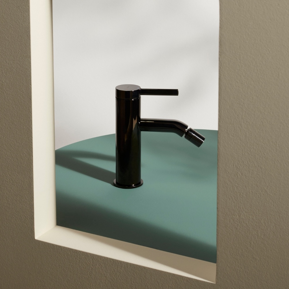 Lifestyle image of the Roca Ona Titanium Black Bidet Mixer Tap with Pop Up Waste